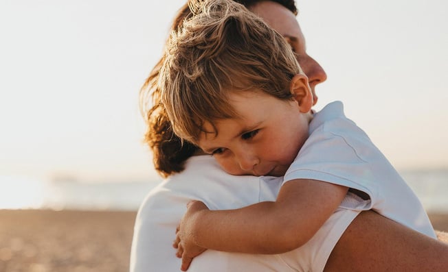 child hugging parent